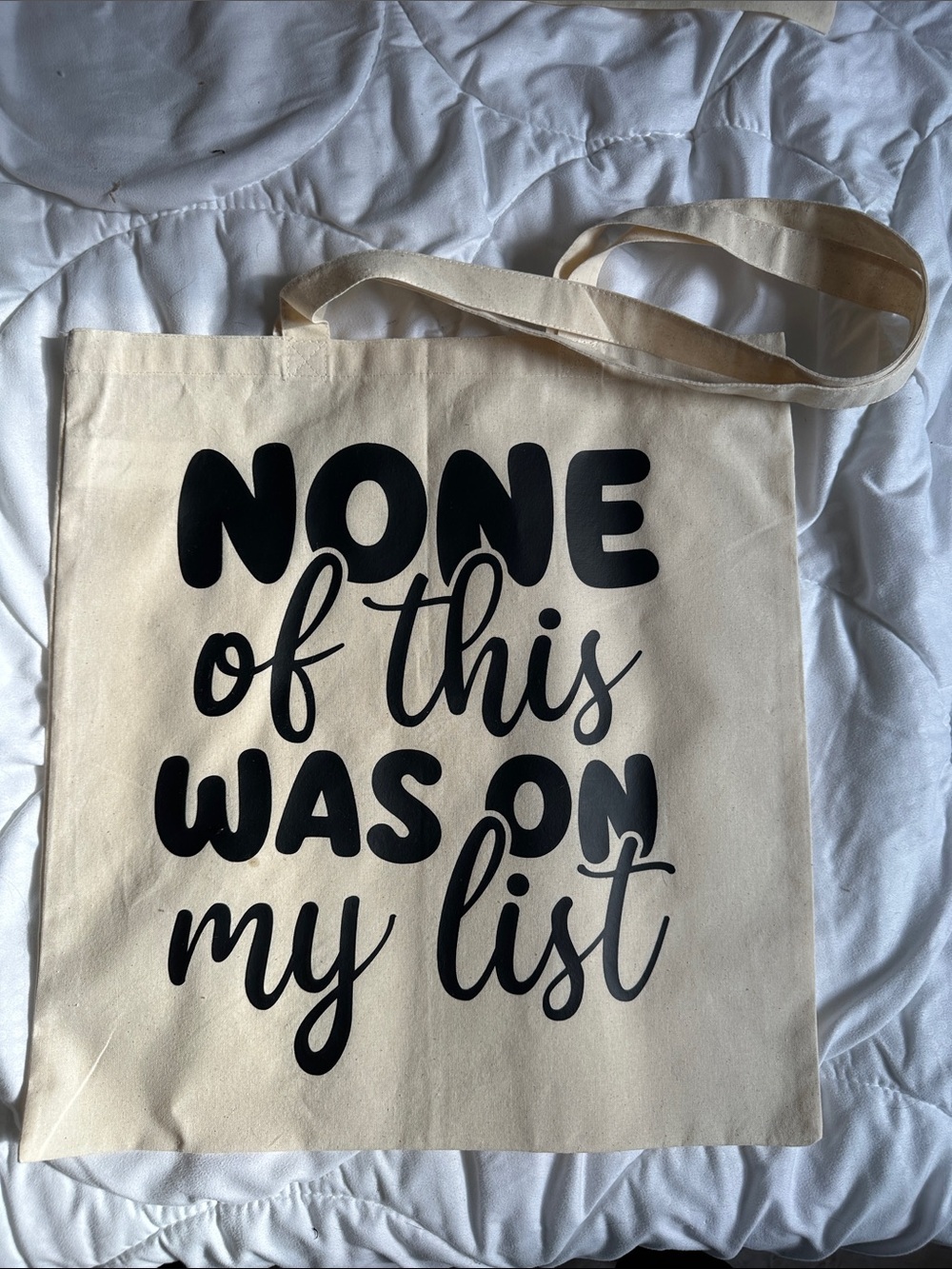 Canvas Tote with Bold Black Script Saying "None of This Was on My List"